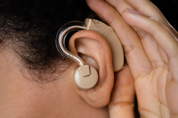 person's ear with hearing aid for Inner ear damage condition